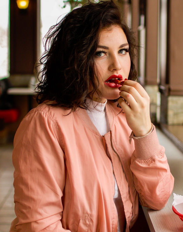 a woman eating a donut